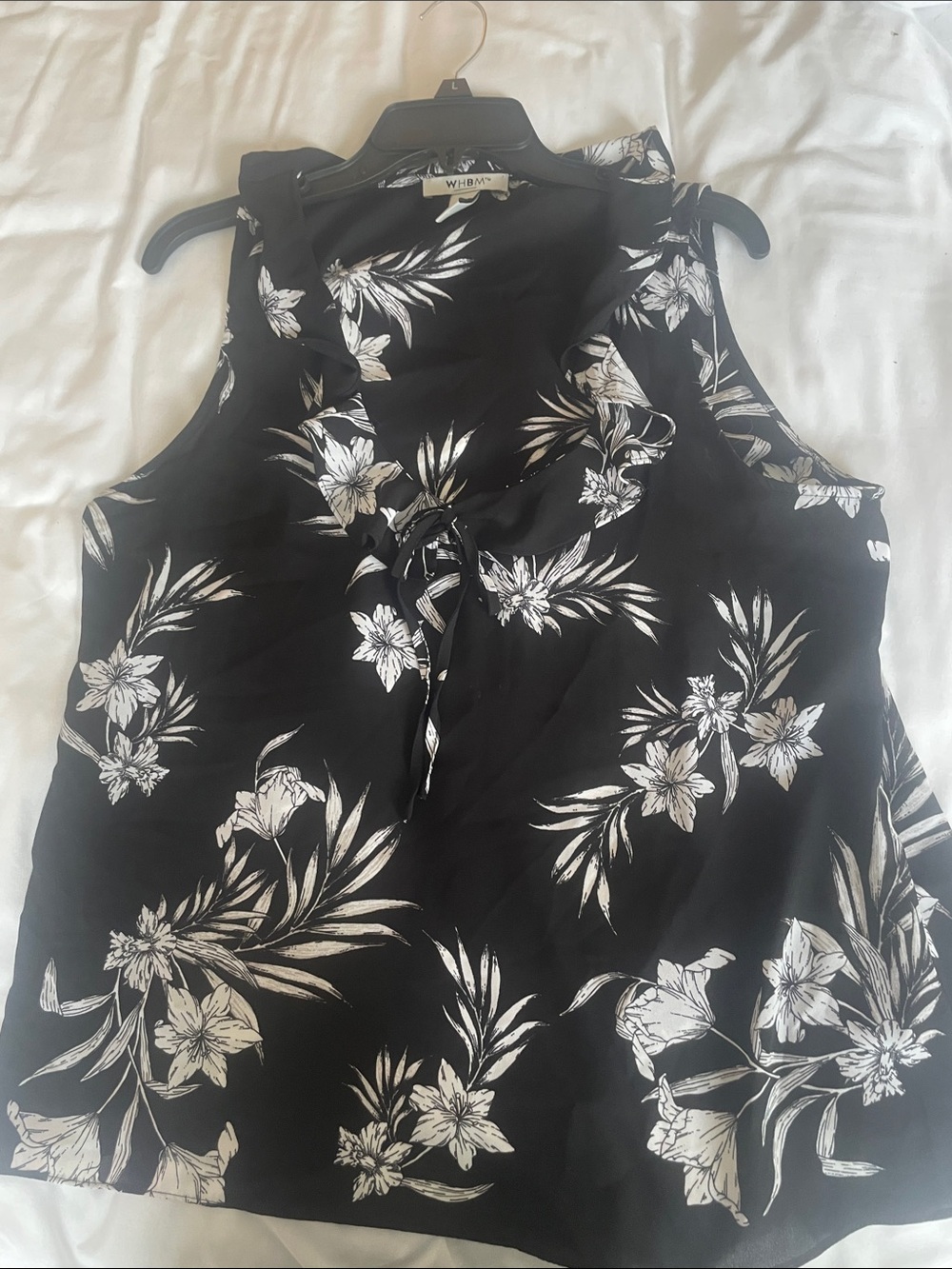 WHBM sleeveless v neck with ruffle. Black and white polyester